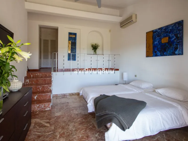 This property is stunning! Set in the heart of Mijas Costa, in the desirable Campo Mijas area. From the private entrance there is a driveway and garage, with steps down into the main entrance. This floor has a very spacious lounge area, with a great recep