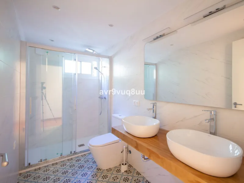 This property is stunning! Set in the heart of Mijas Costa, in the desirable Campo Mijas area. From the private entrance there is a driveway and garage, with steps down into the main entrance. This floor has a very spacious lounge area, with a great recep
