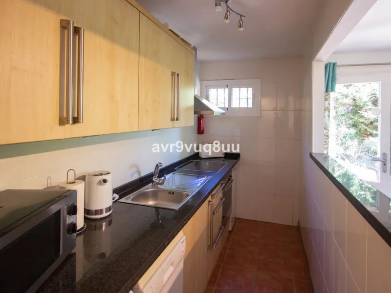 This property is stunning! Set in the heart of Mijas Costa, in the desirable Campo Mijas area. From the private entrance there is a driveway and garage, with steps down into the main entrance. This floor has a very spacious lounge area, with a great recep