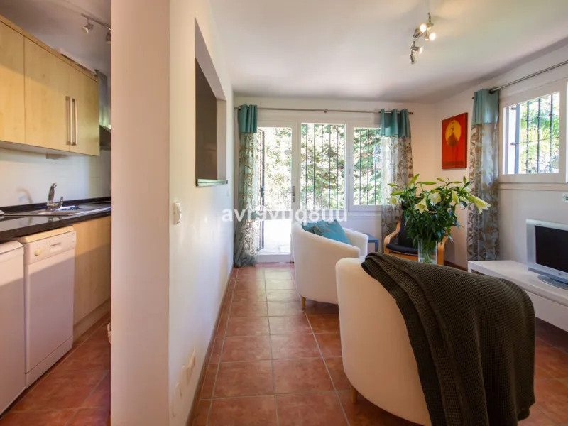 This property is stunning! Set in the heart of Mijas Costa, in the desirable Campo Mijas area. From the private entrance there is a driveway and garage, with steps down into the main entrance. This floor has a very spacious lounge area, with a great recep