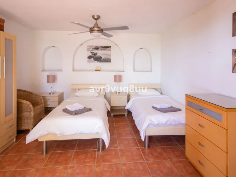 This property is stunning! Set in the heart of Mijas Costa, in the desirable Campo Mijas area. From the private entrance there is a driveway and garage, with steps down into the main entrance. This floor has a very spacious lounge area, with a great recep