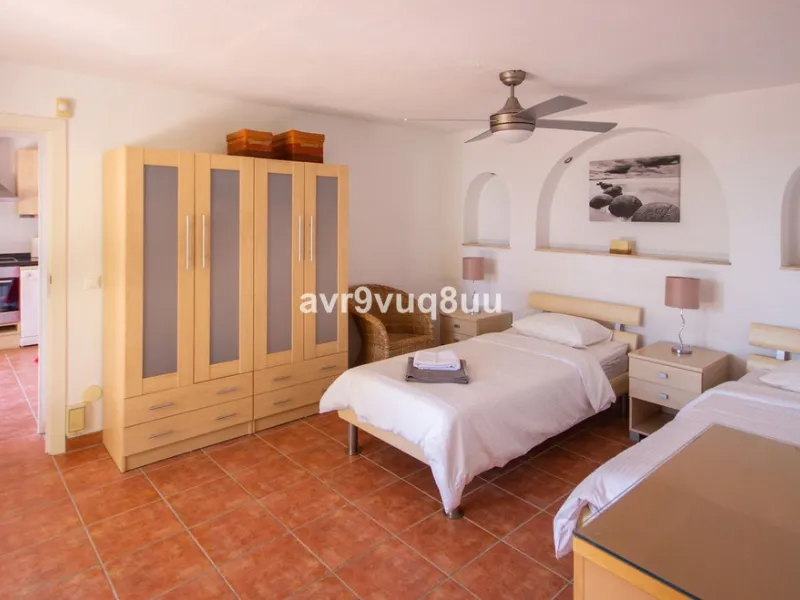 This property is stunning! Set in the heart of Mijas Costa, in the desirable Campo Mijas area. From the private entrance there is a driveway and garage, with steps down into the main entrance. This floor has a very spacious lounge area, with a great recep