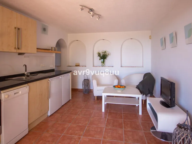 This property is stunning! Set in the heart of Mijas Costa, in the desirable Campo Mijas area. From the private entrance there is a driveway and garage, with steps down into the main entrance. This floor has a very spacious lounge area, with a great recep