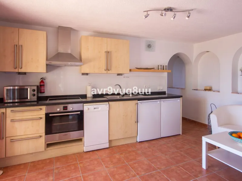 This property is stunning! Set in the heart of Mijas Costa, in the desirable Campo Mijas area. From the private entrance there is a driveway and garage, with steps down into the main entrance. This floor has a very spacious lounge area, with a great recep