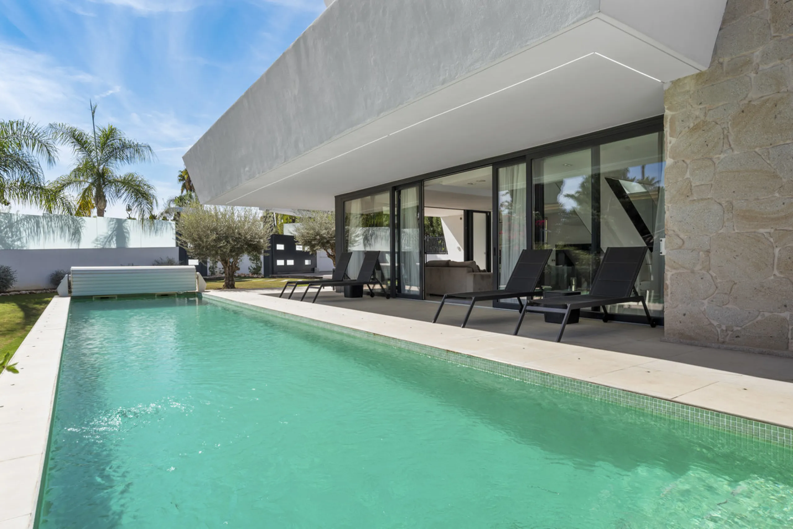 Nestled in the prestigious enclave of La Cerquilla, Villa La Cerquilla is a sanctuary of contemporary luxury surrounded by the beauty of Marbella's Golf Valley. Behind its private gates, the residence opens onto five generous double bedrooms, including a 