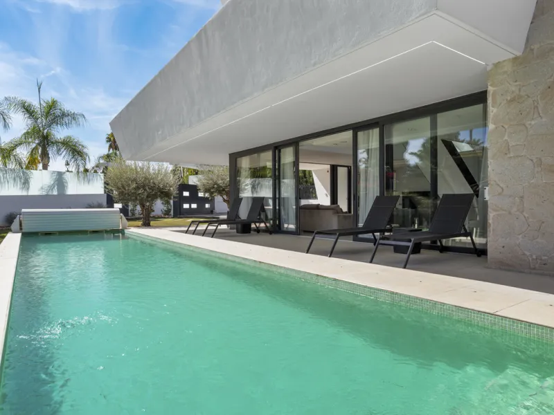 Nestled in the prestigious enclave of La Cerquilla, Villa La Cerquilla is a sanctuary of contemporary luxury surrounded by the beauty of Marbella's Golf Valley. Behind its private gates, the residence opens onto five generous double bedrooms, including a 