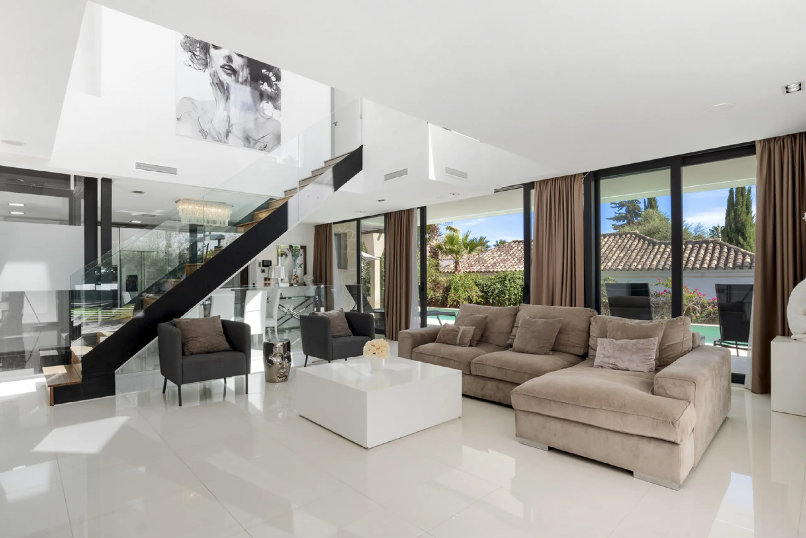 Nestled in the prestigious enclave of La Cerquilla, Villa La Cerquilla is a sanctuary of contemporary luxury surrounded by the beauty of Marbella's Golf Valley. Behind its private gates, the residence opens onto five generous double bedrooms, including a 