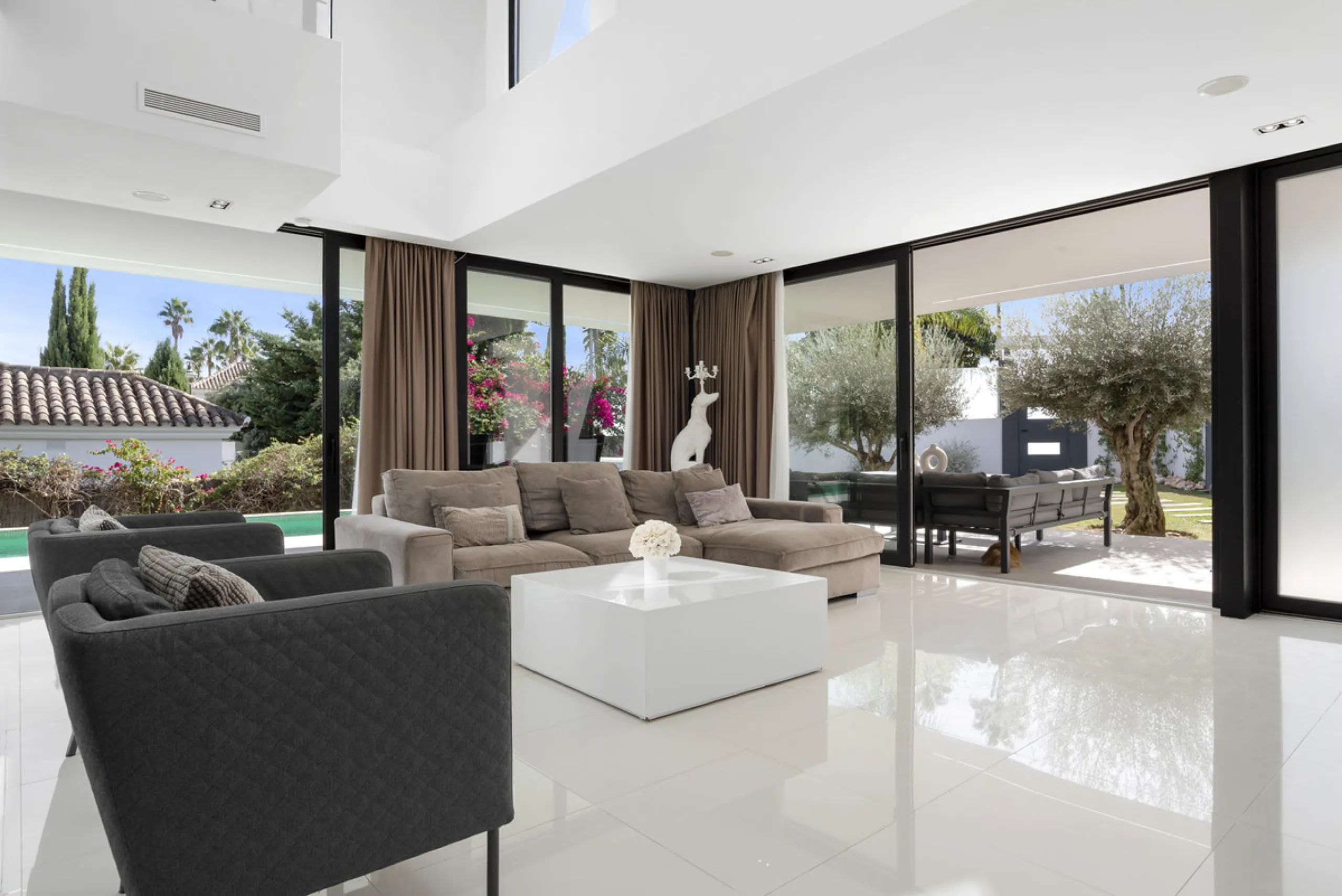 Nestled in the prestigious enclave of La Cerquilla, Villa La Cerquilla is a sanctuary of contemporary luxury surrounded by the beauty of Marbella's Golf Valley. Behind its private gates, the residence opens onto five generous double bedrooms, including a 