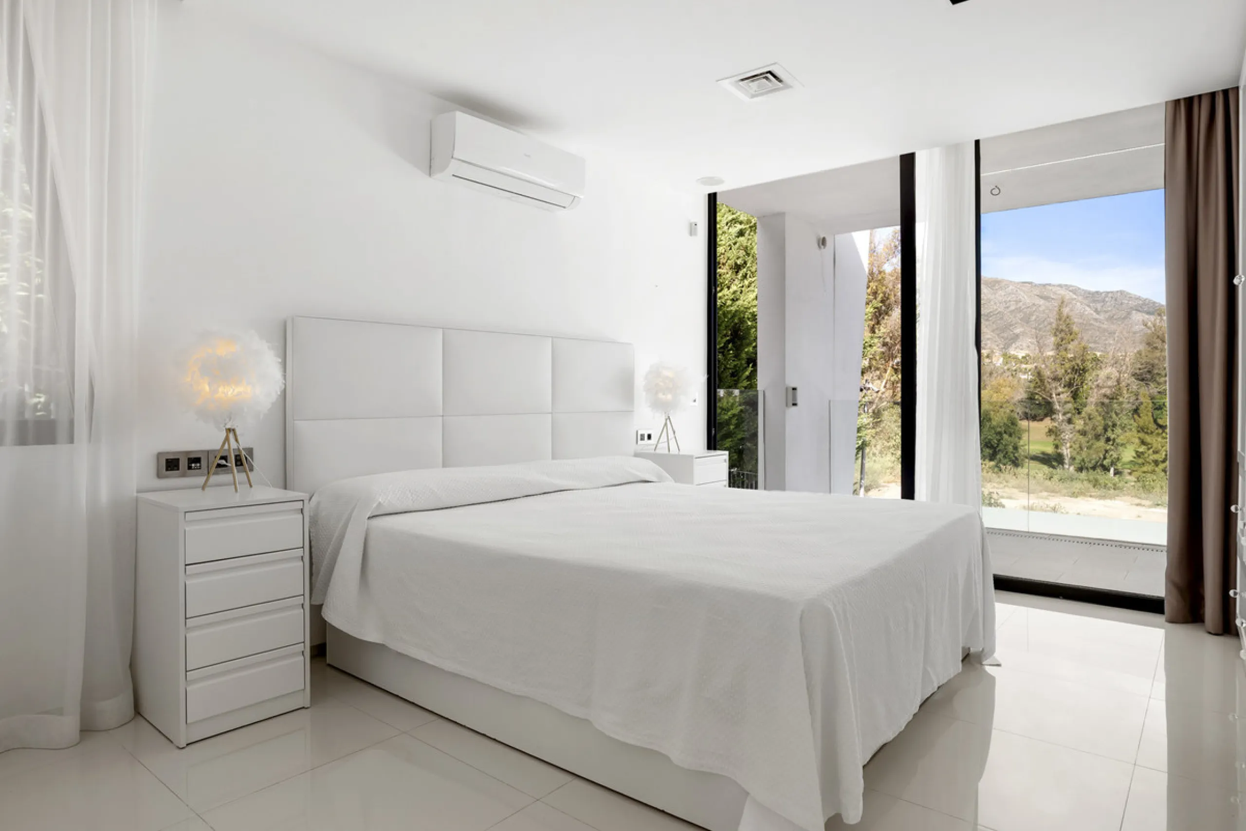Nestled in the prestigious enclave of La Cerquilla, Villa La Cerquilla is a sanctuary of contemporary luxury surrounded by the beauty of Marbella's Golf Valley. Behind its private gates, the residence opens onto five generous double bedrooms, including a 