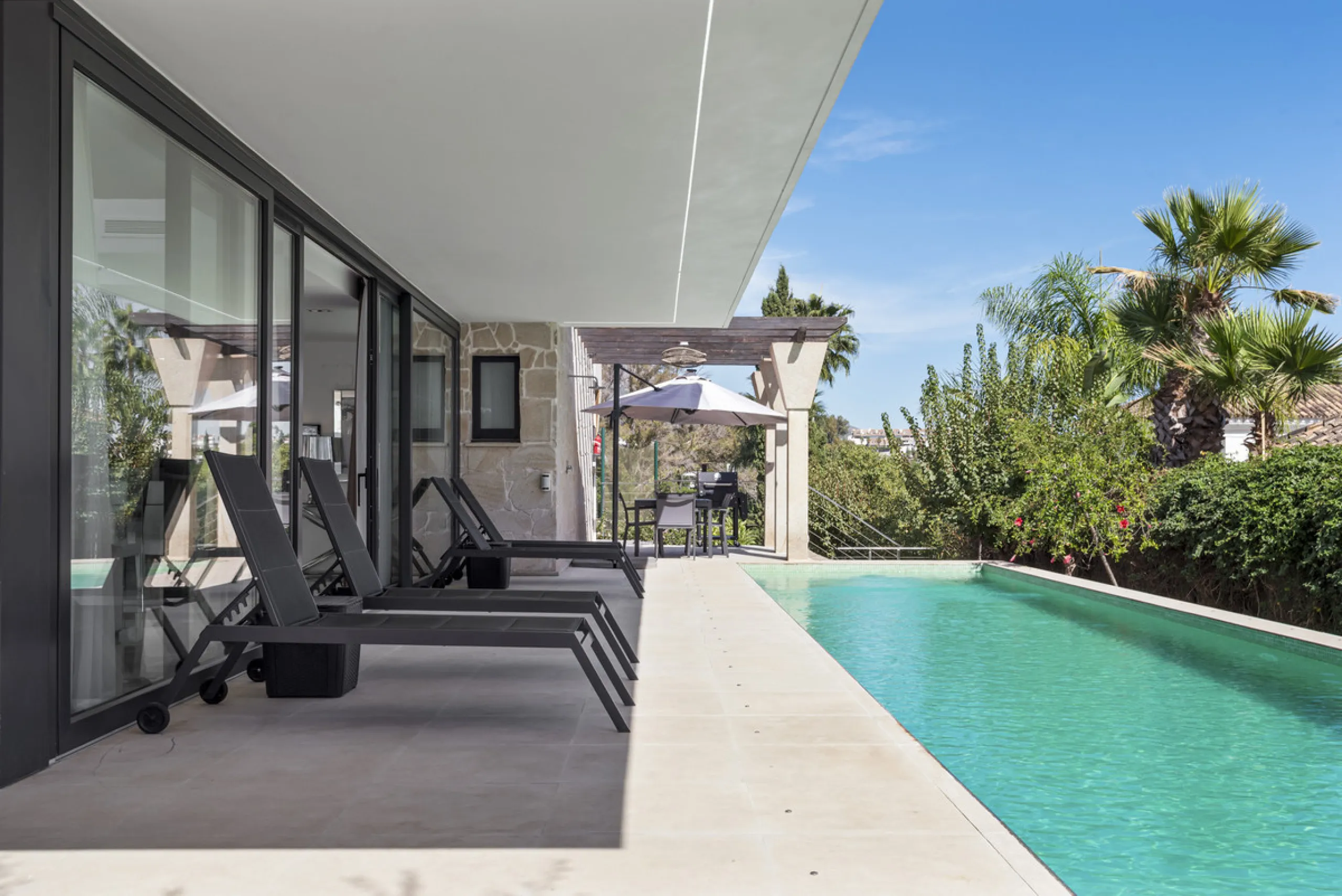 Nestled in the prestigious enclave of La Cerquilla, Villa La Cerquilla is a sanctuary of contemporary luxury surrounded by the beauty of Marbella's Golf Valley. Behind its private gates, the residence opens onto five generous double bedrooms, including a 