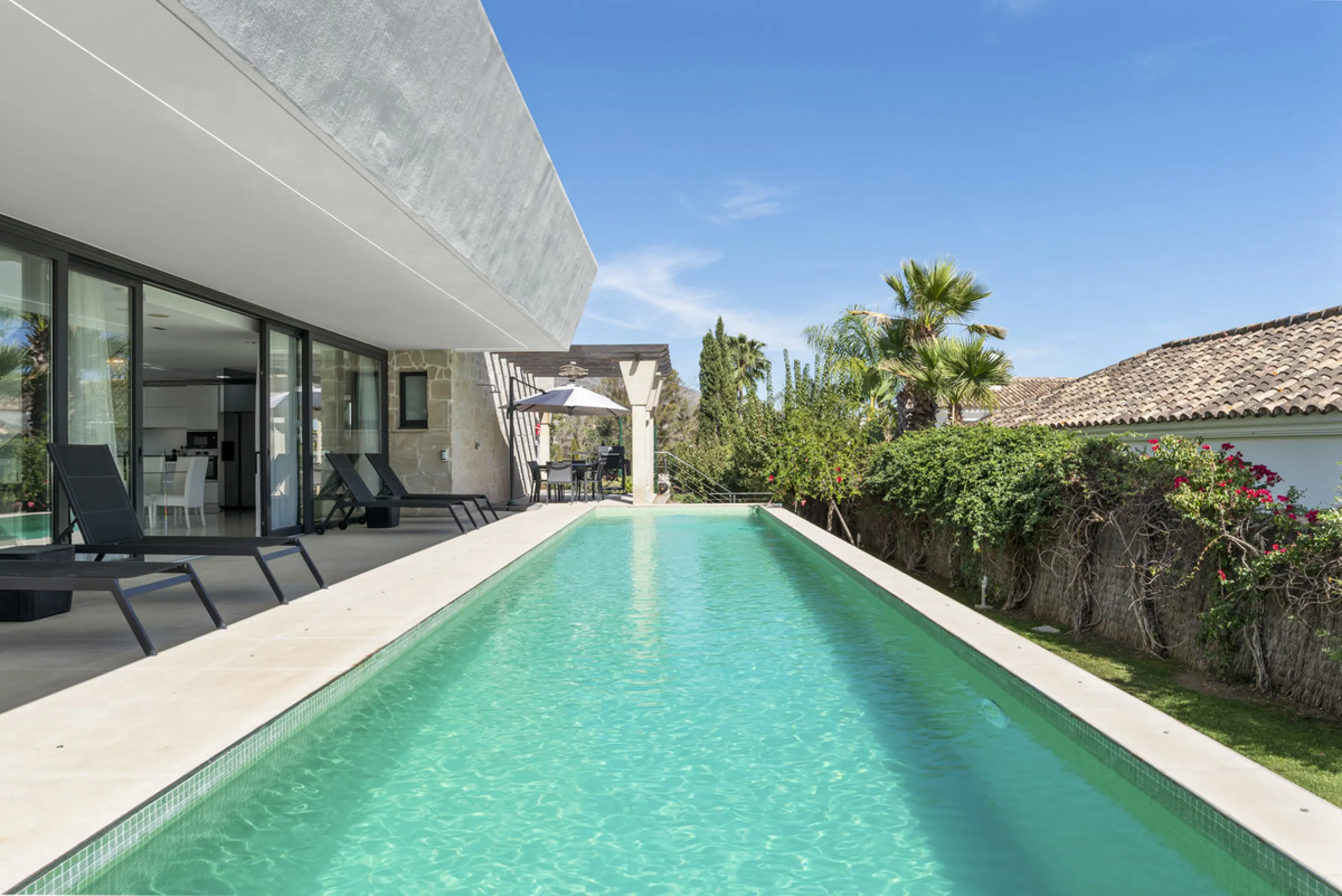 Nestled in the prestigious enclave of La Cerquilla, Villa La Cerquilla is a sanctuary of contemporary luxury surrounded by the beauty of Marbella's Golf Valley. Behind its private gates, the residence opens onto five generous double bedrooms, including a 