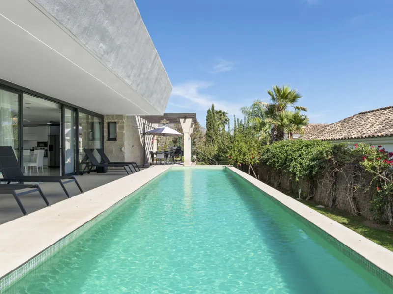 Nestled in the prestigious enclave of La Cerquilla, Villa La Cerquilla is a sanctuary of contemporary luxury surrounded by the beauty of Marbella's Golf Valley. Behind its private gates, the residence opens onto five generous double bedrooms, including a 