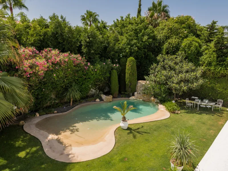 Impressive luxurious Andalusian style villa on the Atalaya beachside, a few steps from the beach.