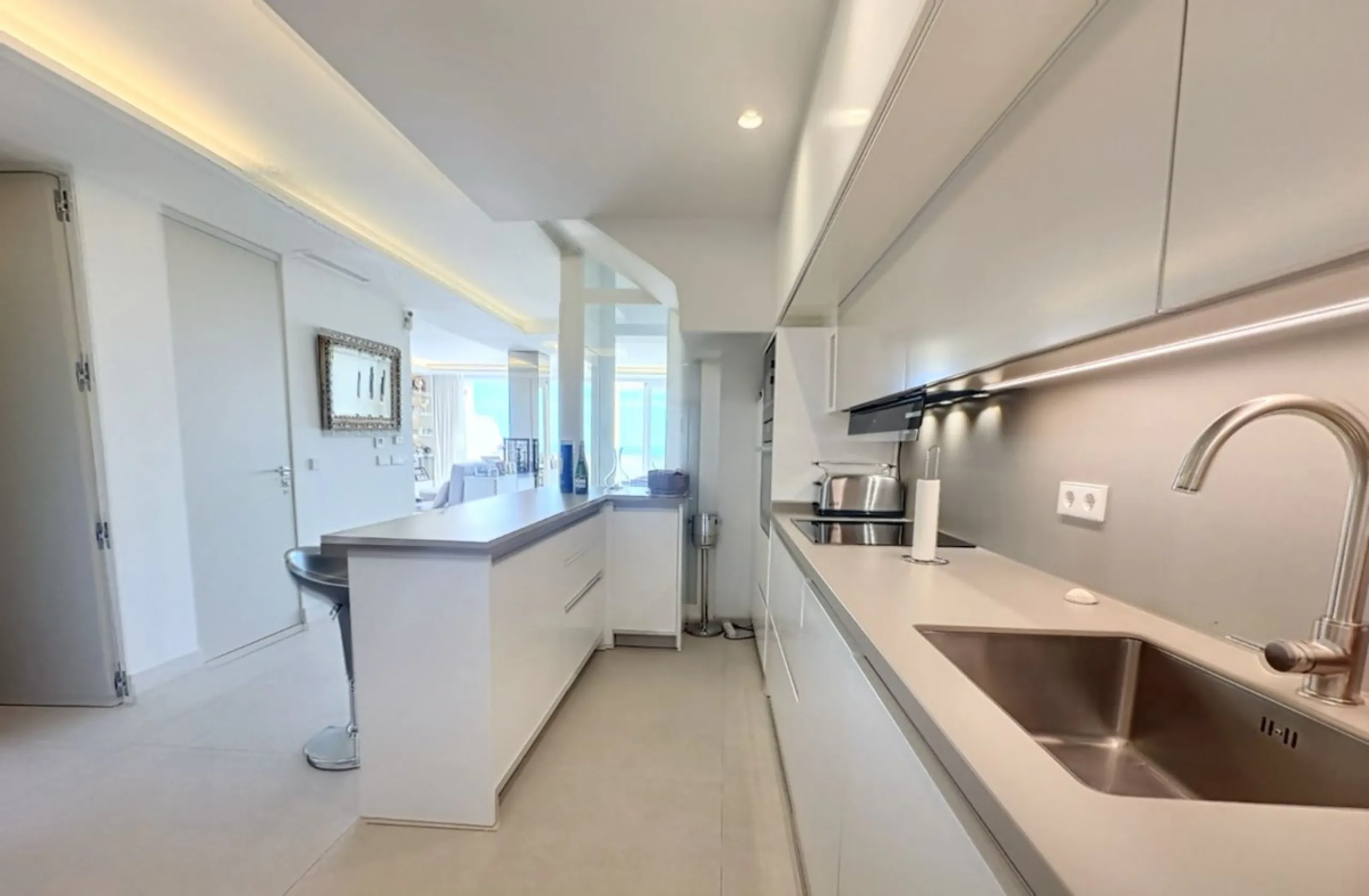 This exceptional triplex penthouse stands out as one of the most unique and meticulously designed properties in the Selwo area of Estepona. Its current owners, **renowned interior designers**, carried out a complete **bespoke, full-scale renovation**, ori