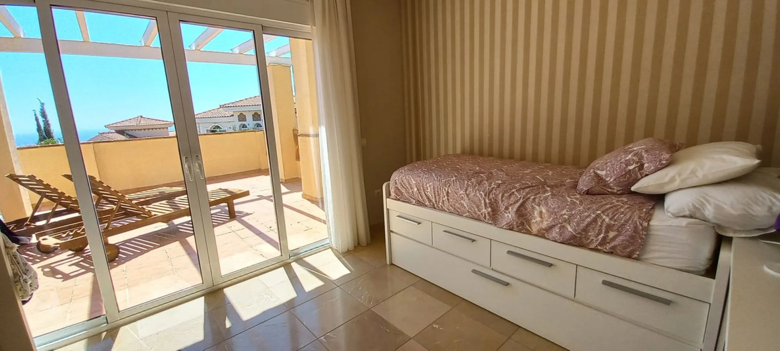Located in the rolling hills of Mijas Costa, in the upper part of Riviera del Sol, this large villa offers the perfect balance of space, comfort, and convenience for family living. Positioned beside Cala Nova and right next to the exciting new One Bali Vi