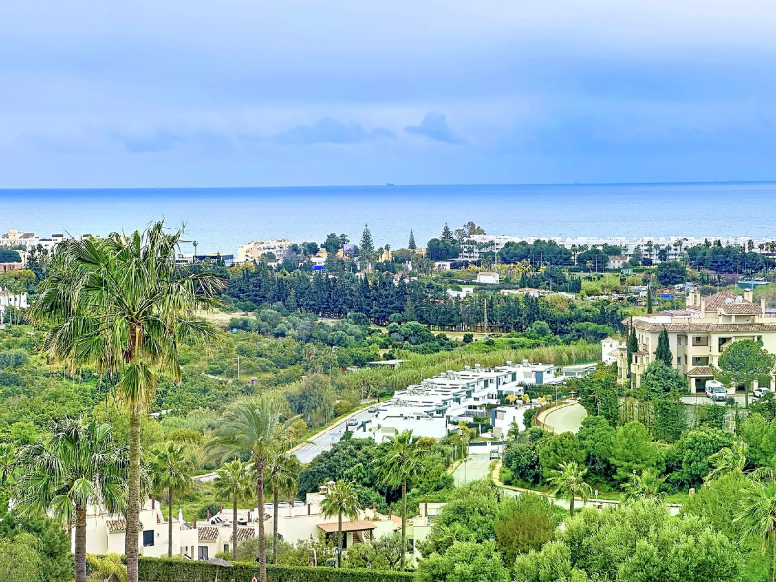 Imagine waking up each morning to soft Mediterranean light streaming through the windows, the calm of a beautifully maintained community, and the sea breeze accompanying your first coffee of the day. All of this from a spacious glass-enclosed terrace with