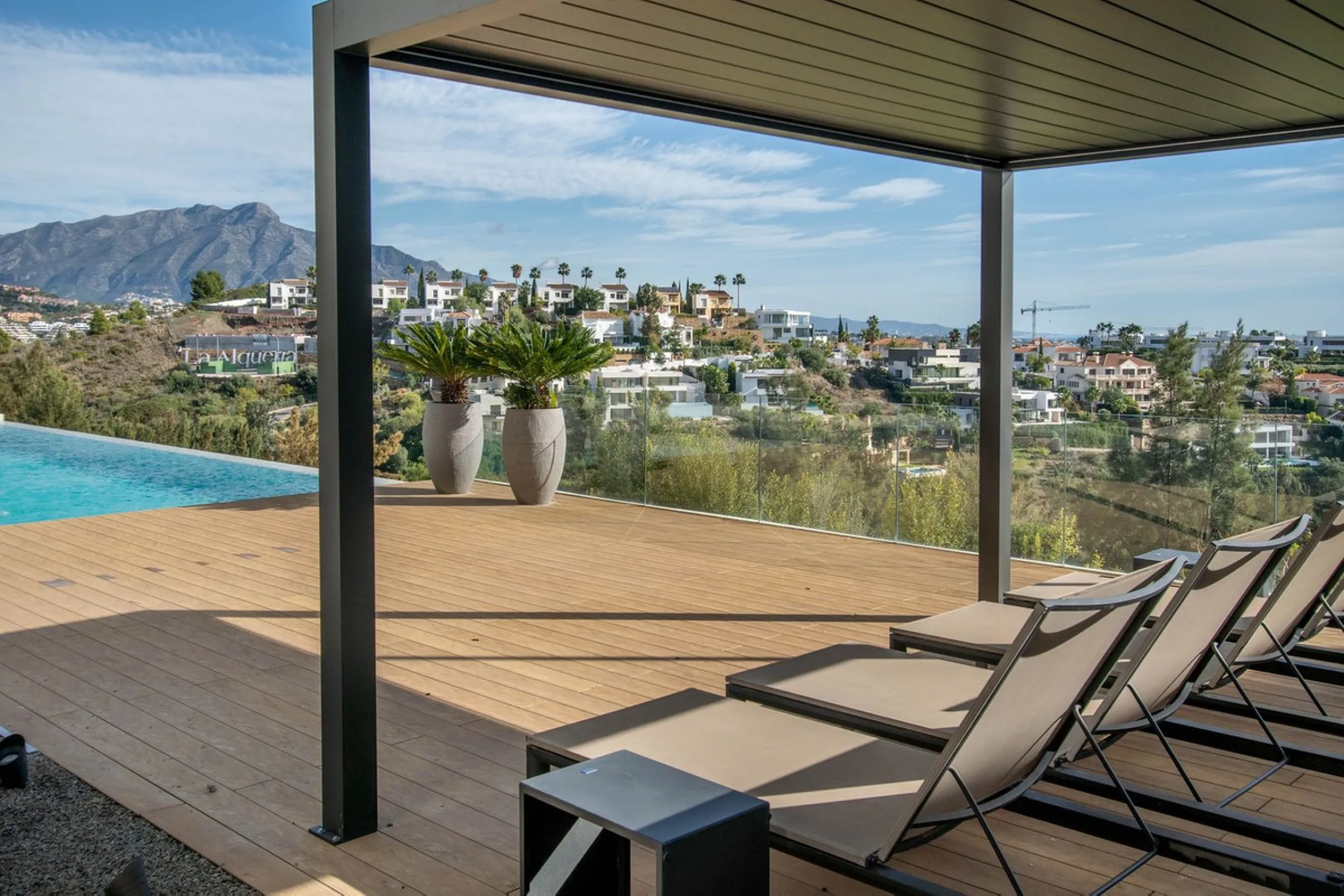 Stunning contemporary villa with panoramic mountain, golf and sea views in La Alqueria, Benahavis
