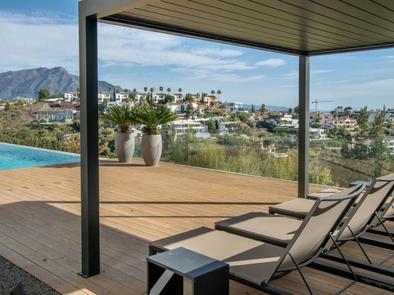 Stunning contemporary villa with panoramic mountain, golf and sea views in La Alqueria, Benahavis
