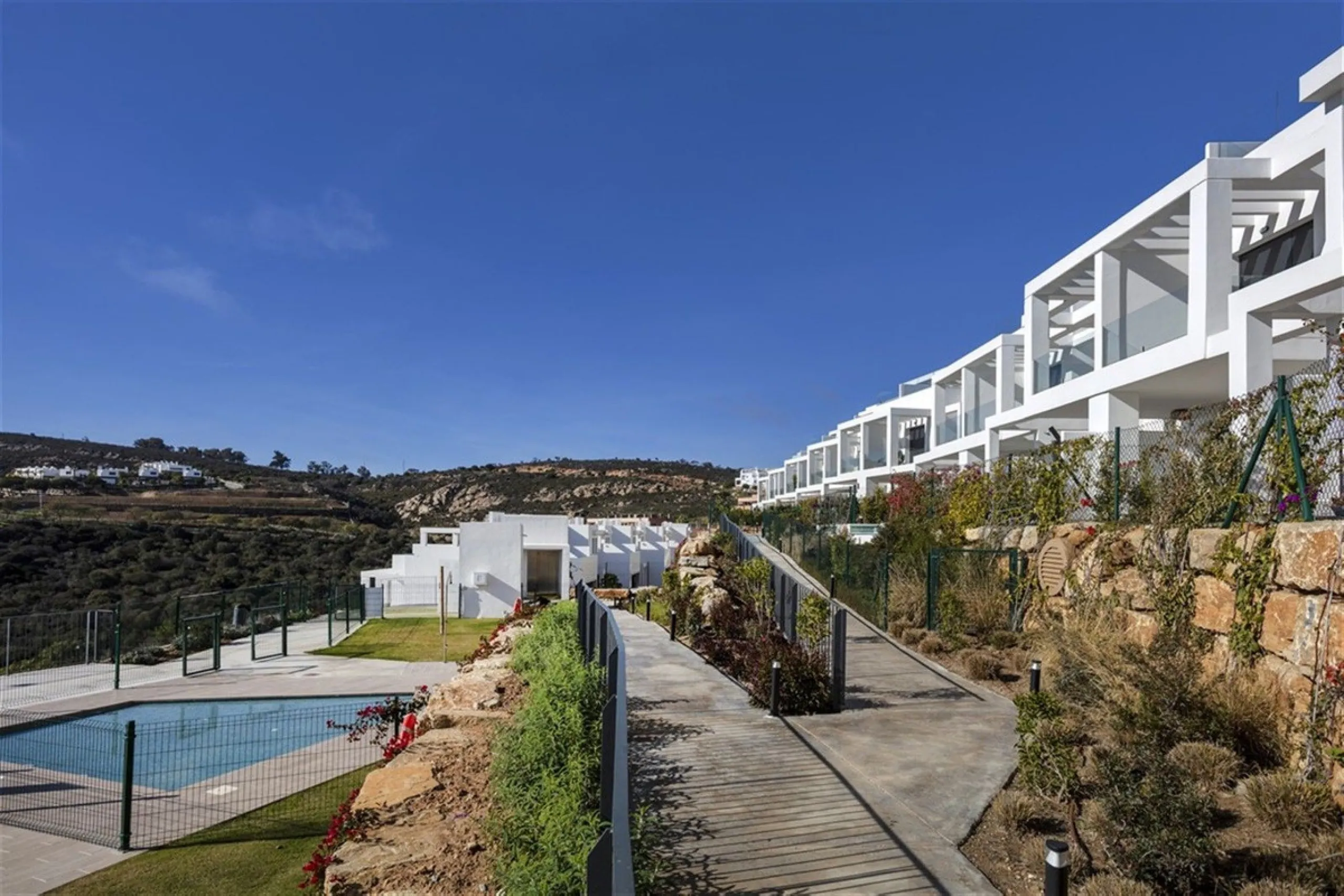 Contemporary and luxurious four level family home offering stunning panoramic views only 10 minutes to Sotogrande.