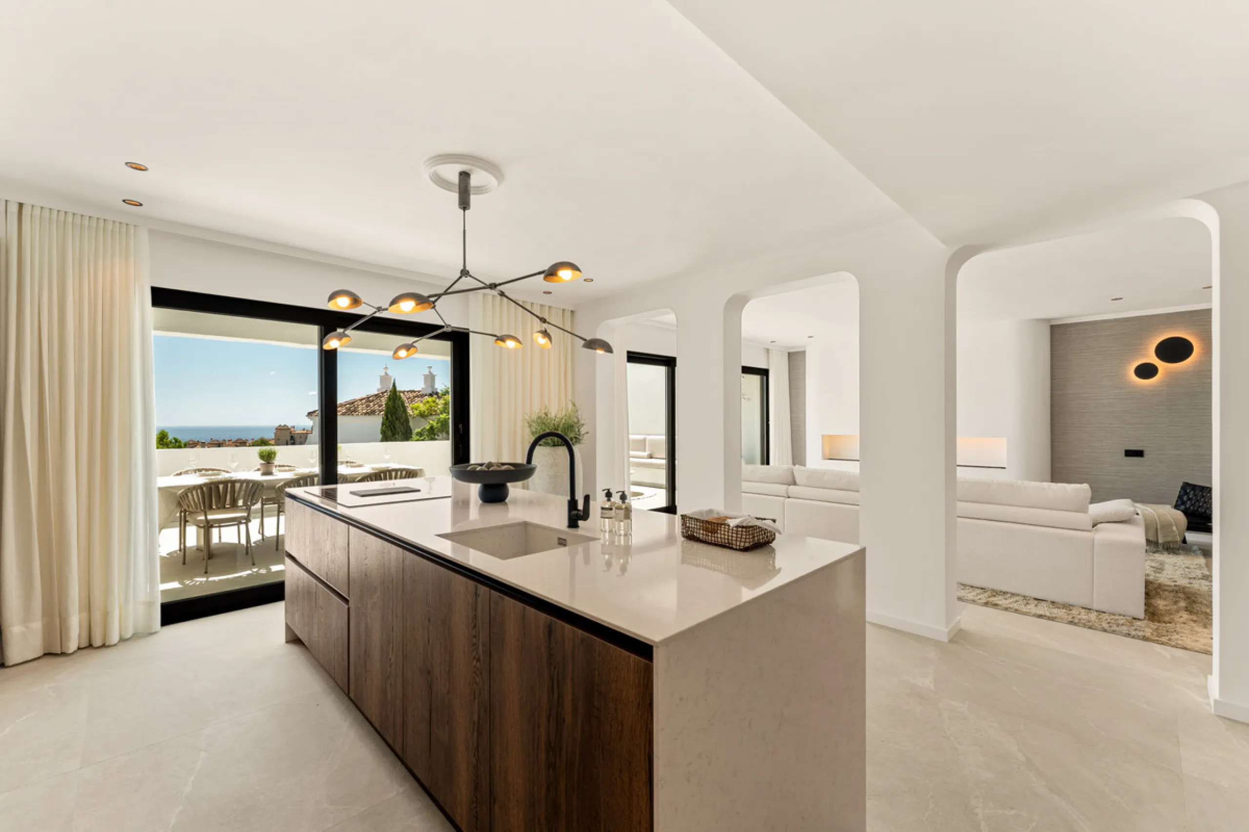 Contemporary duplex for sale in the exclusive Las Colinas de Marbella community in Benahavís, offering three bedrooms and three bathroom.  Designed with both style and function in mind, this home brings together modern living spaces with panoramic sea and