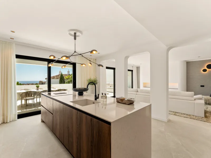 Contemporary duplex for sale in the exclusive Las Colinas de Marbella community in Benahavís, offering three bedrooms and three bathroom.  Designed with both style and function in mind, this home brings together modern living spaces with panoramic sea and