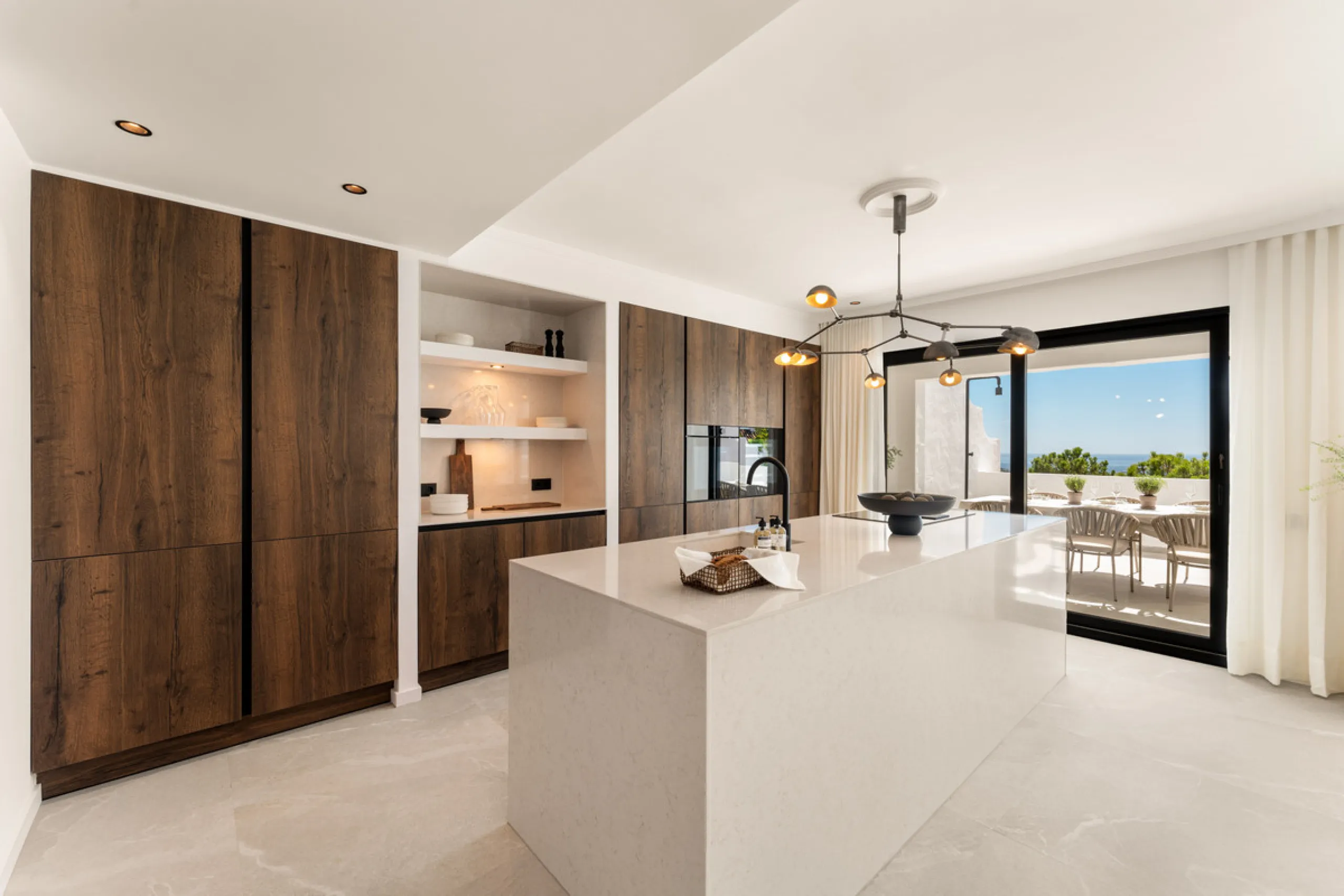 Contemporary duplex for sale in the exclusive Las Colinas de Marbella community in Benahavís, offering three bedrooms and three bathroom.  Designed with both style and function in mind, this home brings together modern living spaces with panoramic sea and