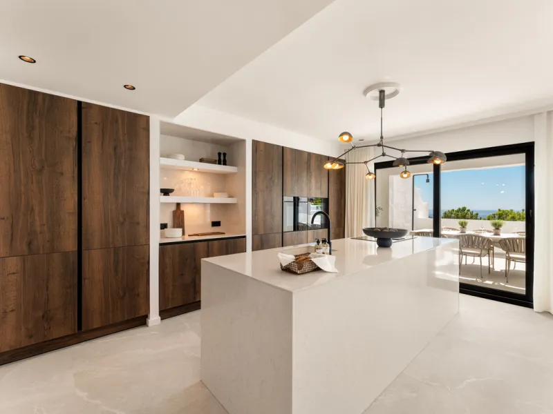Contemporary duplex for sale in the exclusive Las Colinas de Marbella community in Benahavís, offering three bedrooms and three bathroom.  Designed with both style and function in mind, this home brings together modern living spaces with panoramic sea and