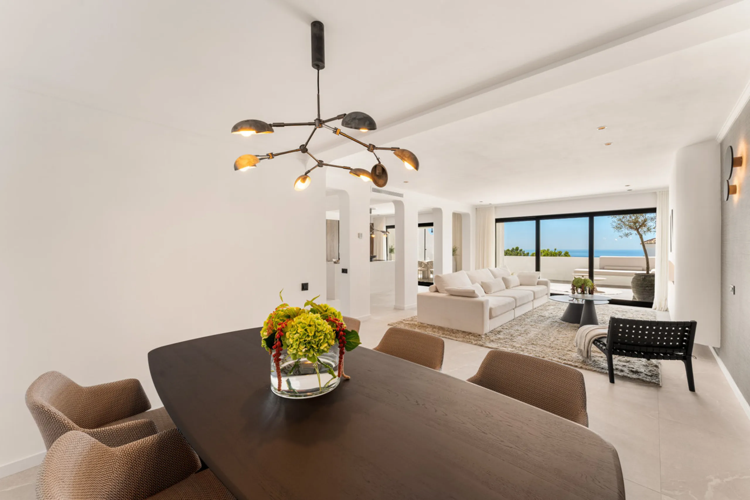 Contemporary duplex for sale in the exclusive Las Colinas de Marbella community in Benahavís, offering three bedrooms and three bathroom.  Designed with both style and function in mind, this home brings together modern living spaces with panoramic sea and