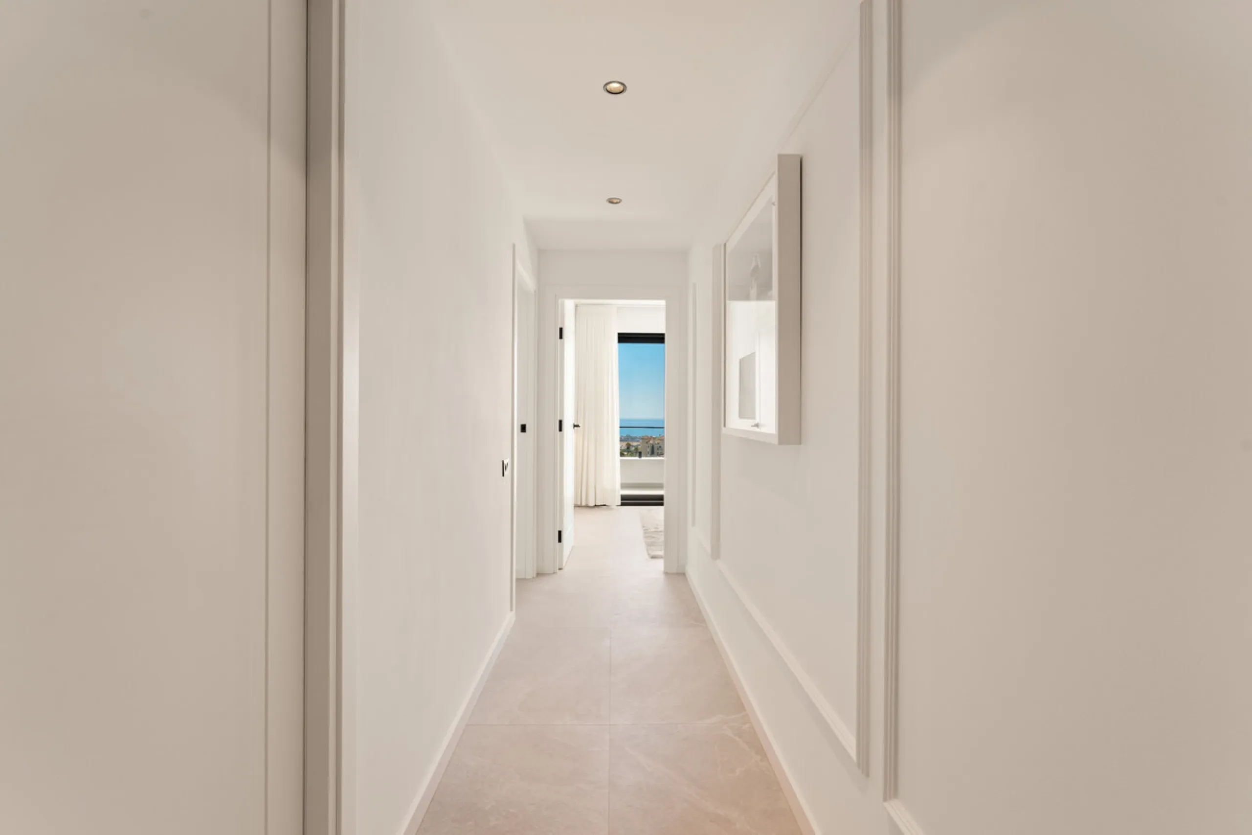 Contemporary duplex for sale in the exclusive Las Colinas de Marbella community in Benahavís, offering three bedrooms and three bathroom.  Designed with both style and function in mind, this home brings together modern living spaces with panoramic sea and