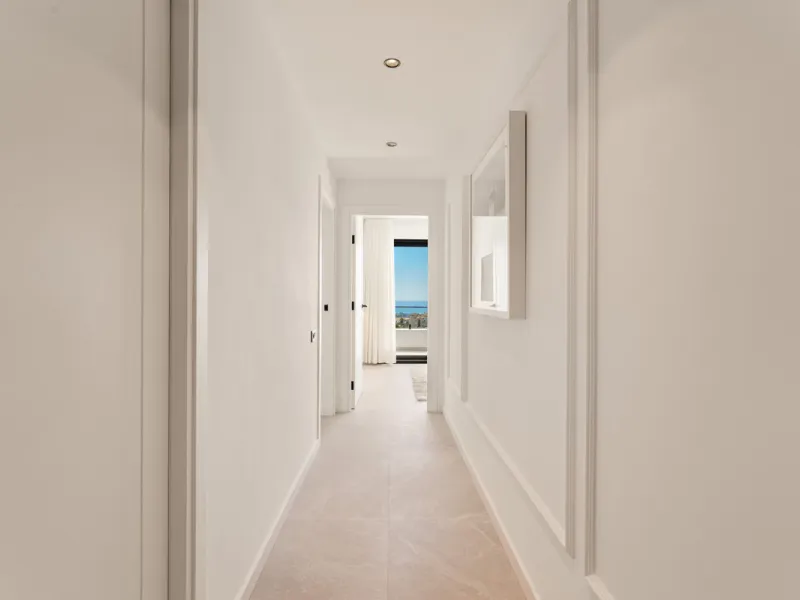 Contemporary duplex for sale in the exclusive Las Colinas de Marbella community in Benahavís, offering three bedrooms and three bathroom.  Designed with both style and function in mind, this home brings together modern living spaces with panoramic sea and