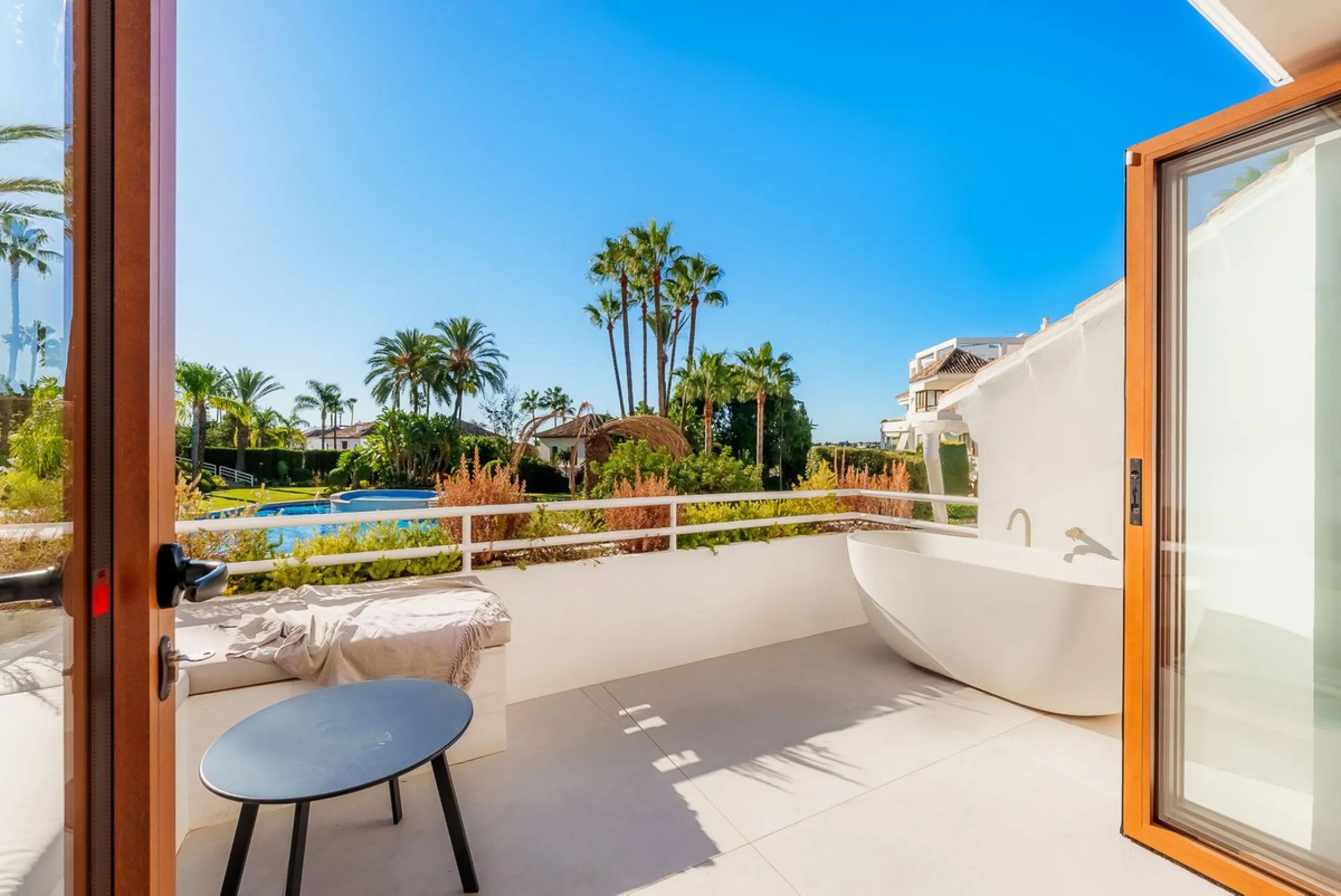 Welcome to this newly renovated duplex ground floor apartment in the heart of Nueva Andalucia, Marbella.