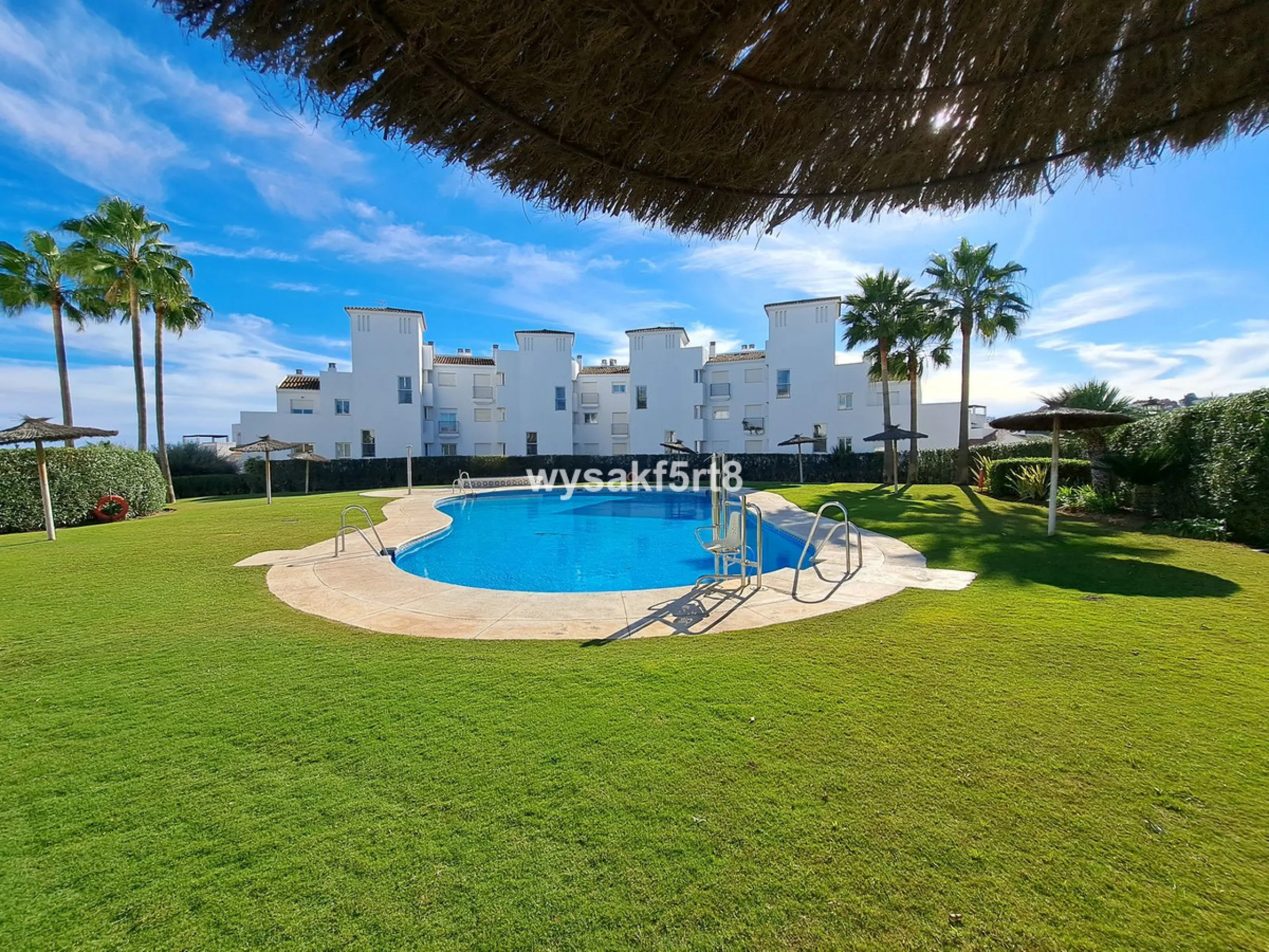 For sale, South East facing middle floor apartment in an established gated community within Los Hidalgos area of La Duquesa, Manilva Costa del Sol, located just 5 minutes from the beach.