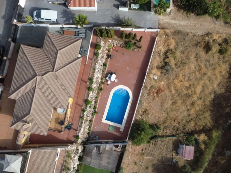With incredible views down the valley to the coast of Málaga and the sea, this impressive, detached villa can be used as either a spacious family home or has the possibility of being a high-end B&B business.