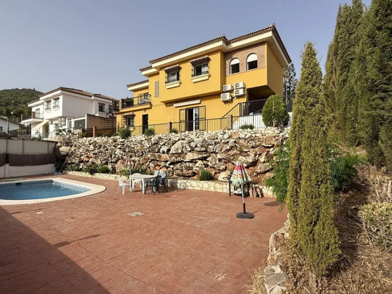 With incredible views down the valley to the coast of Málaga and the sea, this impressive, detached villa can be used as either a spacious family home or has the possibility of being a high-end B&B business.