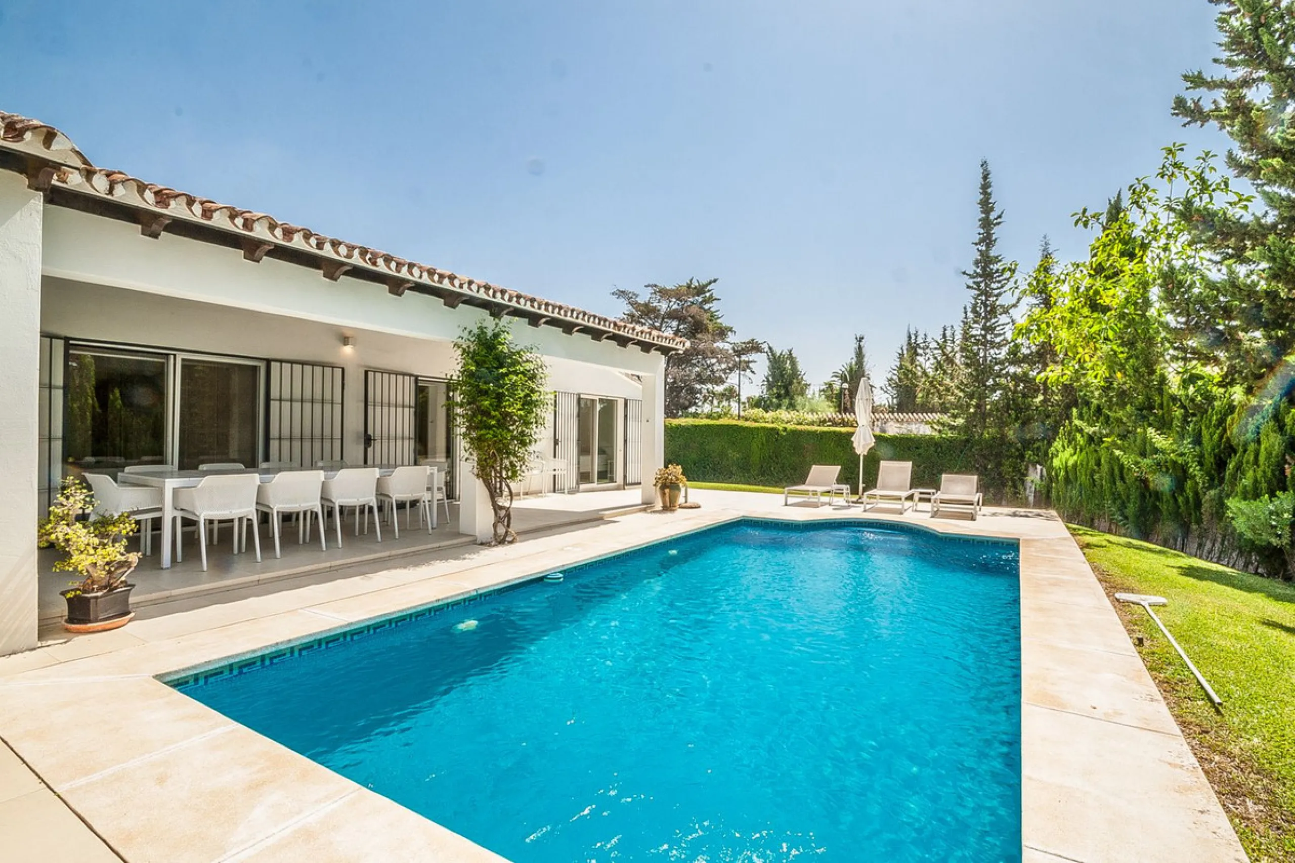 Discover your dream home in this beautifully designed one-level residence, bathed in natural light and featuring direct access to a stunning pool. With five spacious bedrooms and three modern bathrooms, this property is perfect for families or as a lucrat