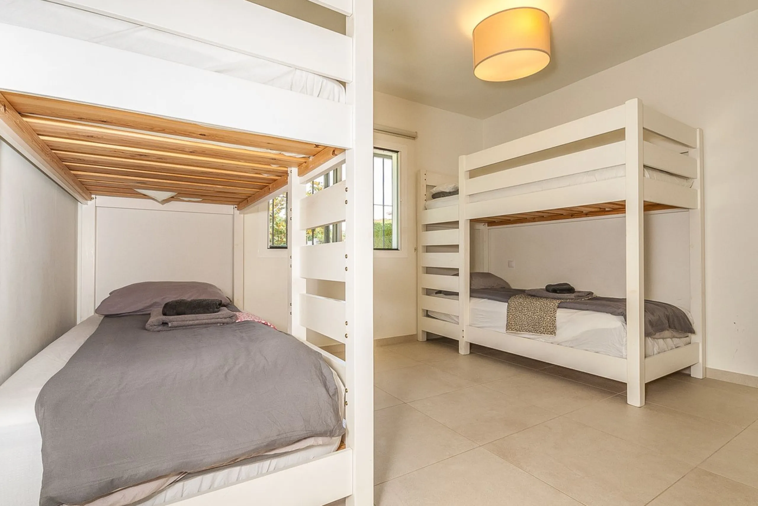Discover your dream home in this beautifully designed one-level residence, bathed in natural light and featuring direct access to a stunning pool. With five spacious bedrooms and three modern bathrooms, this property is perfect for families or as a lucrat