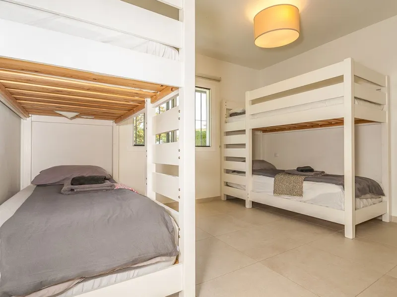 Discover your dream home in this beautifully designed one-level residence, bathed in natural light and featuring direct access to a stunning pool. With five spacious bedrooms and three modern bathrooms, this property is perfect for families or as a lucrat