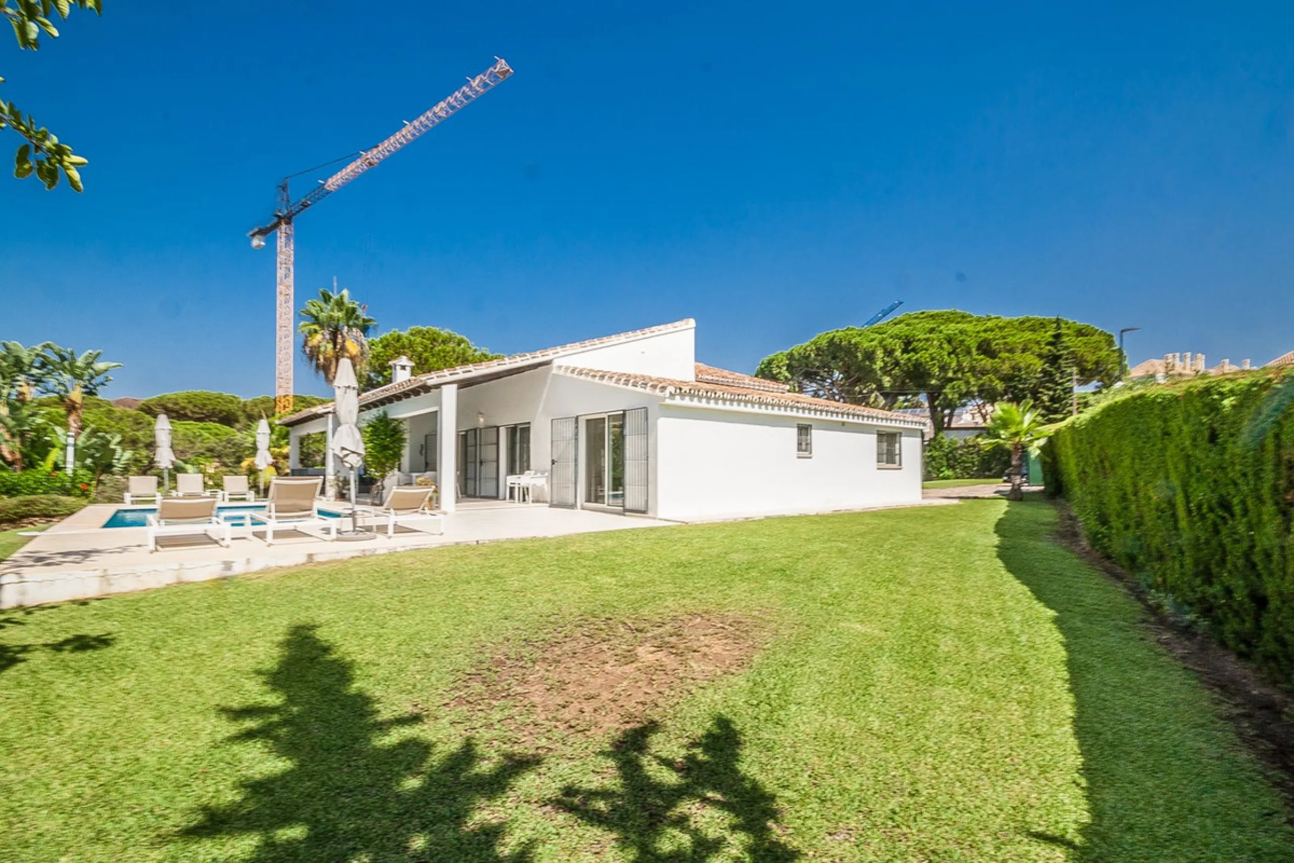 Discover your dream home in this beautifully designed one-level residence, bathed in natural light and featuring direct access to a stunning pool. With five spacious bedrooms and three modern bathrooms, this property is perfect for families or as a lucrat