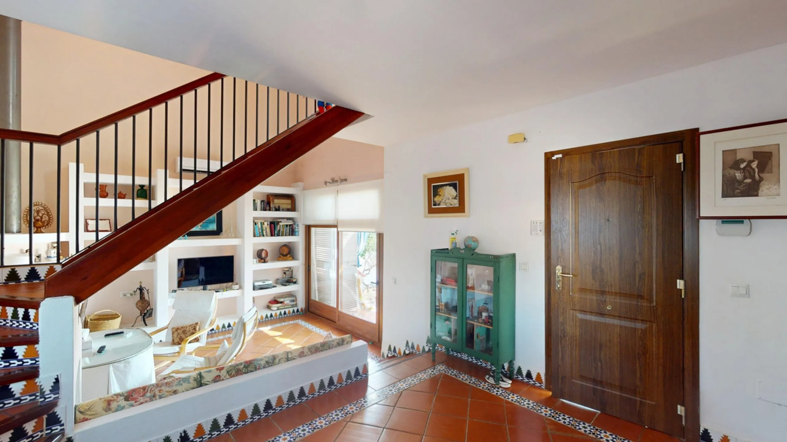 This beautiful Spanish villa spans two floors and features three bedrooms, including an impressive primary suite, and two bathrooms, blending traditional Andalusian charm with modern comfort. The Mediterranean-inspired design is reflected in the terracott