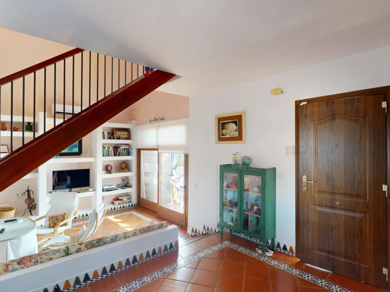 This beautiful Spanish villa spans two floors and features three bedrooms, including an impressive primary suite, and two bathrooms, blending traditional Andalusian charm with modern comfort. The Mediterranean-inspired design is reflected in the terracott