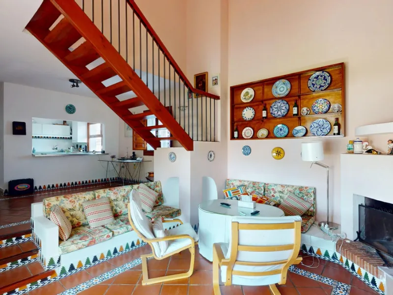 This beautiful Spanish villa spans two floors and features three bedrooms, including an impressive primary suite, and two bathrooms, blending traditional Andalusian charm with modern comfort. The Mediterranean-inspired design is reflected in the terracott