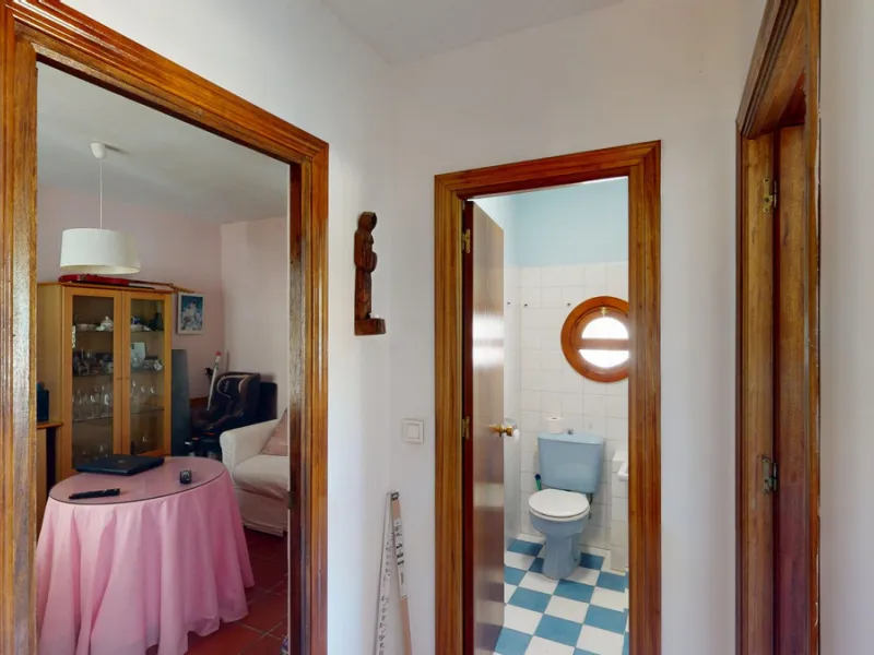 This beautiful Spanish villa spans two floors and features three bedrooms, including an impressive primary suite, and two bathrooms, blending traditional Andalusian charm with modern comfort. The Mediterranean-inspired design is reflected in the terracott