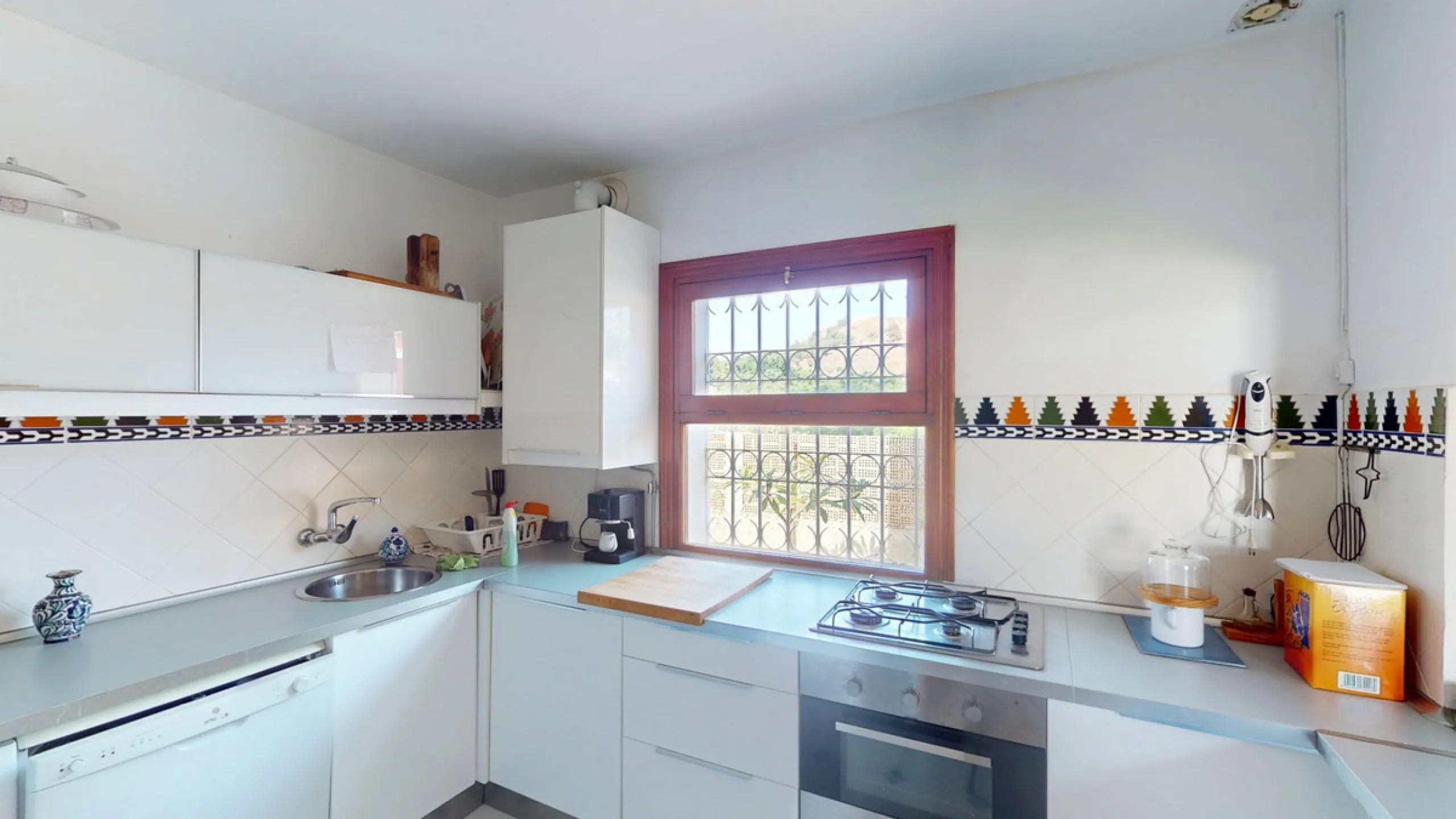 This beautiful Spanish villa spans two floors and features three bedrooms, including an impressive primary suite, and two bathrooms, blending traditional Andalusian charm with modern comfort. The Mediterranean-inspired design is reflected in the terracott
