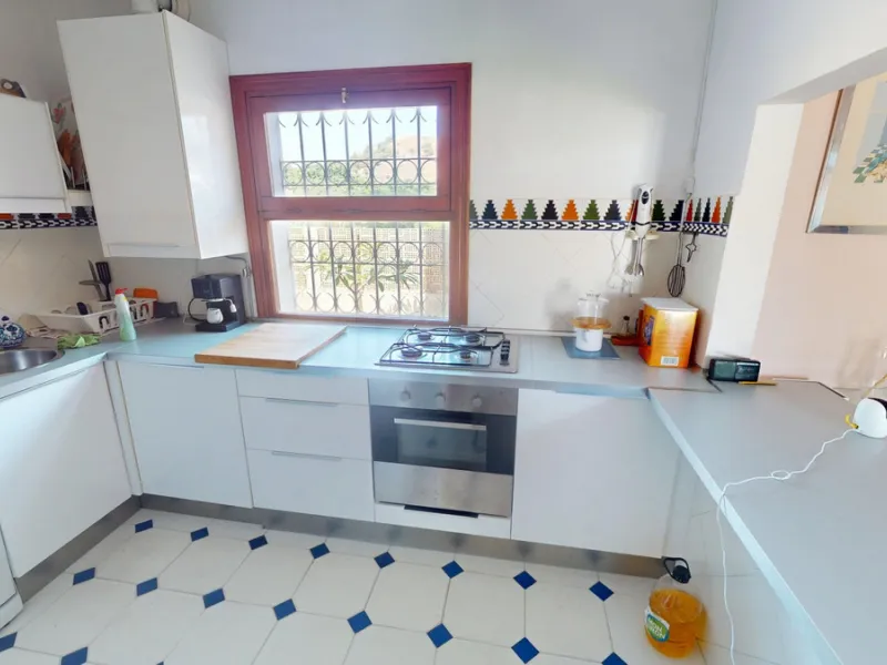 This beautiful Spanish villa spans two floors and features three bedrooms, including an impressive primary suite, and two bathrooms, blending traditional Andalusian charm with modern comfort. The Mediterranean-inspired design is reflected in the terracott