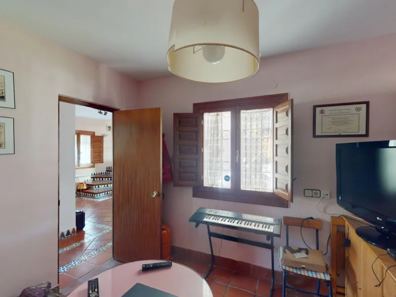 This beautiful Spanish villa spans two floors and features three bedrooms, including an impressive primary suite, and two bathrooms, blending traditional Andalusian charm with modern comfort. The Mediterranean-inspired design is reflected in the terracott