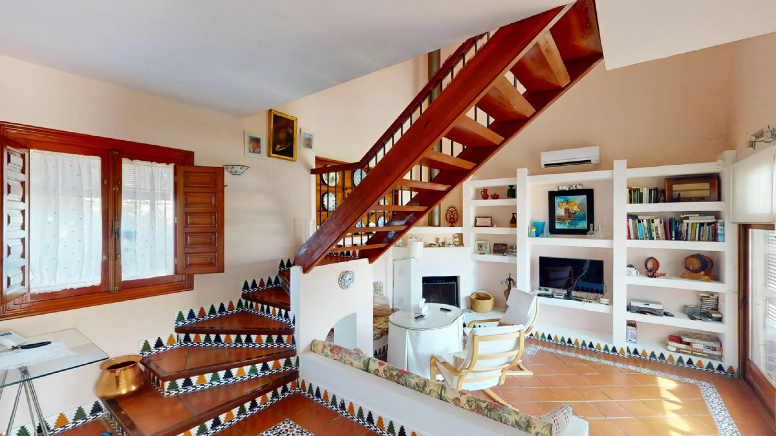 This beautiful Spanish villa spans two floors and features three bedrooms, including an impressive primary suite, and two bathrooms, blending traditional Andalusian charm with modern comfort. The Mediterranean-inspired design is reflected in the terracott
