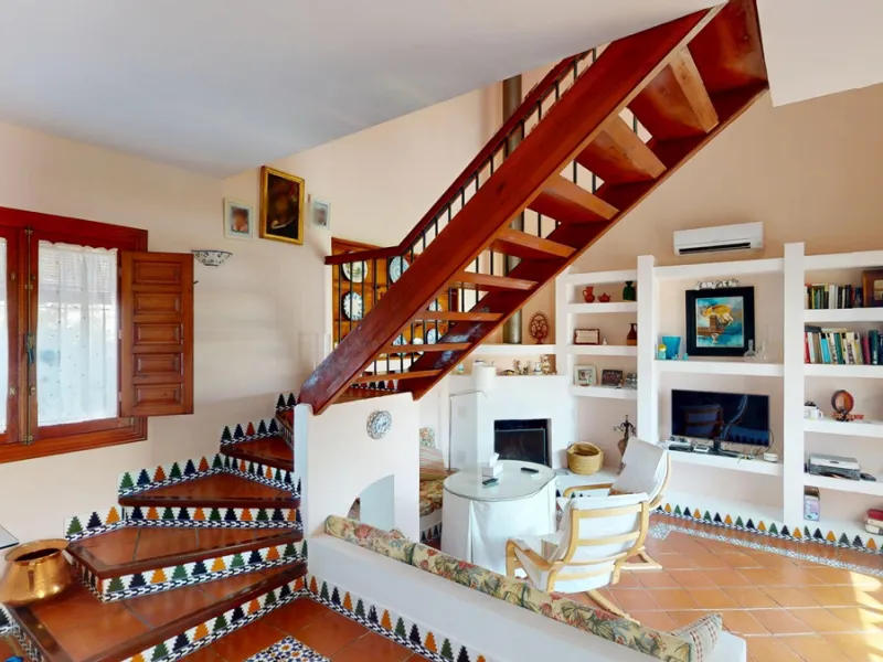 This beautiful Spanish villa spans two floors and features three bedrooms, including an impressive primary suite, and two bathrooms, blending traditional Andalusian charm with modern comfort. The Mediterranean-inspired design is reflected in the terracott
