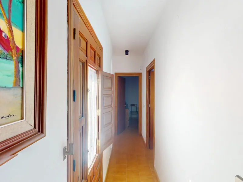 This beautiful Spanish villa spans two floors and features three bedrooms, including an impressive primary suite, and two bathrooms, blending traditional Andalusian charm with modern comfort. The Mediterranean-inspired design is reflected in the terracott