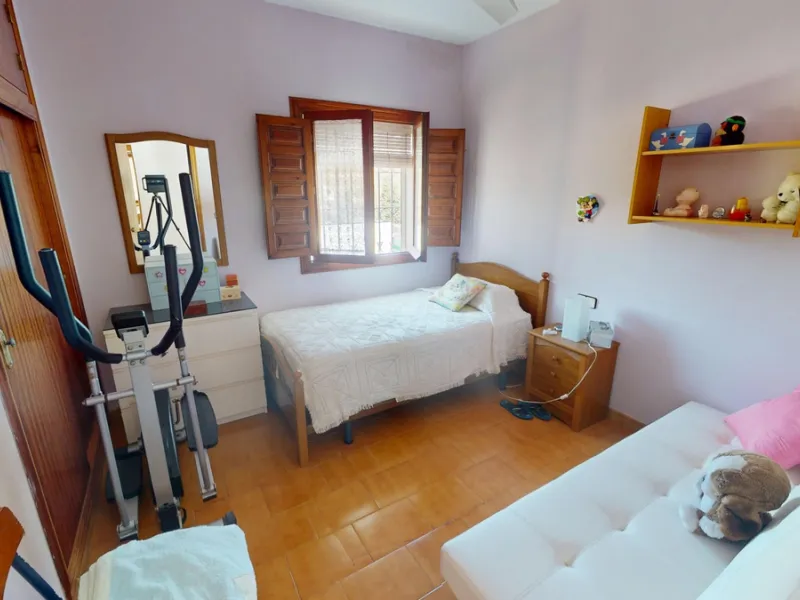 This beautiful Spanish villa spans two floors and features three bedrooms, including an impressive primary suite, and two bathrooms, blending traditional Andalusian charm with modern comfort. The Mediterranean-inspired design is reflected in the terracott