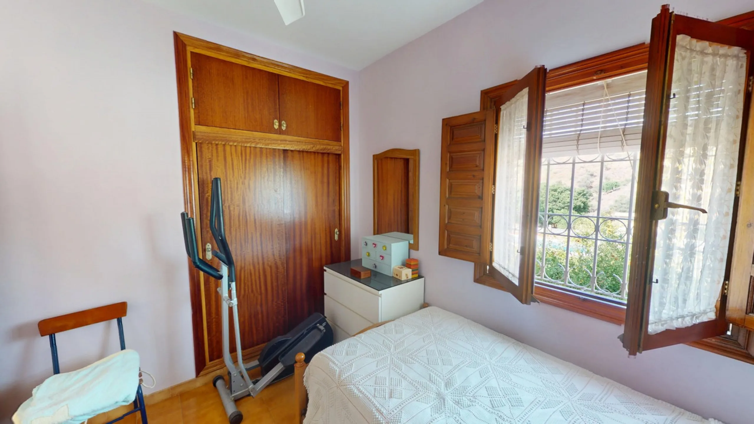 This beautiful Spanish villa spans two floors and features three bedrooms, including an impressive primary suite, and two bathrooms, blending traditional Andalusian charm with modern comfort. The Mediterranean-inspired design is reflected in the terracott